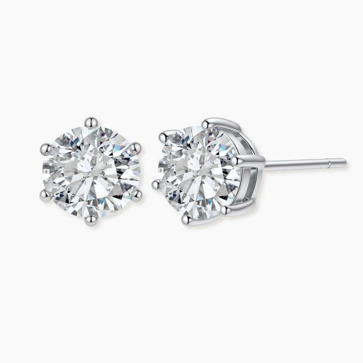 Close-up of round brilliant-cut moissanite stud earrings in 6-prong sterling silver settings showing exceptional sparkle