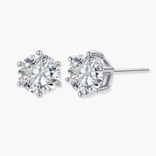 Close-up of round brilliant-cut moissanite stud earrings in 6-prong sterling silver settings showing exceptional sparkle