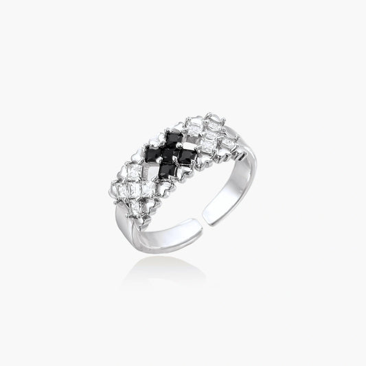 Adjustable white gold plated ring with geometric grid of black and clear zirconia stones in checkerboard pattern