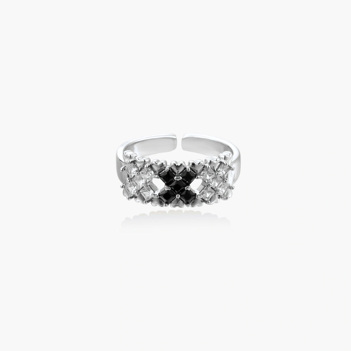 Adjustable white gold plated ring with geometric grid of black and clear zirconia stones in checkerboard pattern