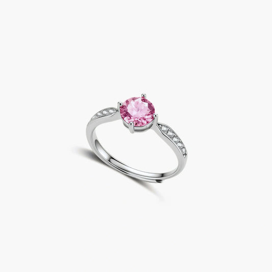 Brilliant pink moissanite ring in sterling silver 4-prong setting with accent stones on adjustable band