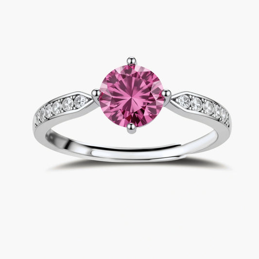 Brilliant pink moissanite ring in sterling silver 4-prong setting with accent stones on adjustable band