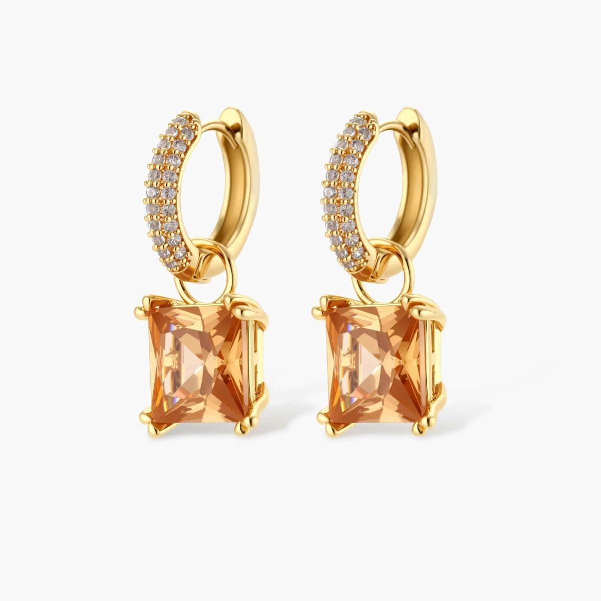 14K gold plated jewelry set featuring square champagne CZ stones with sparkling huggie earrings on cream background.