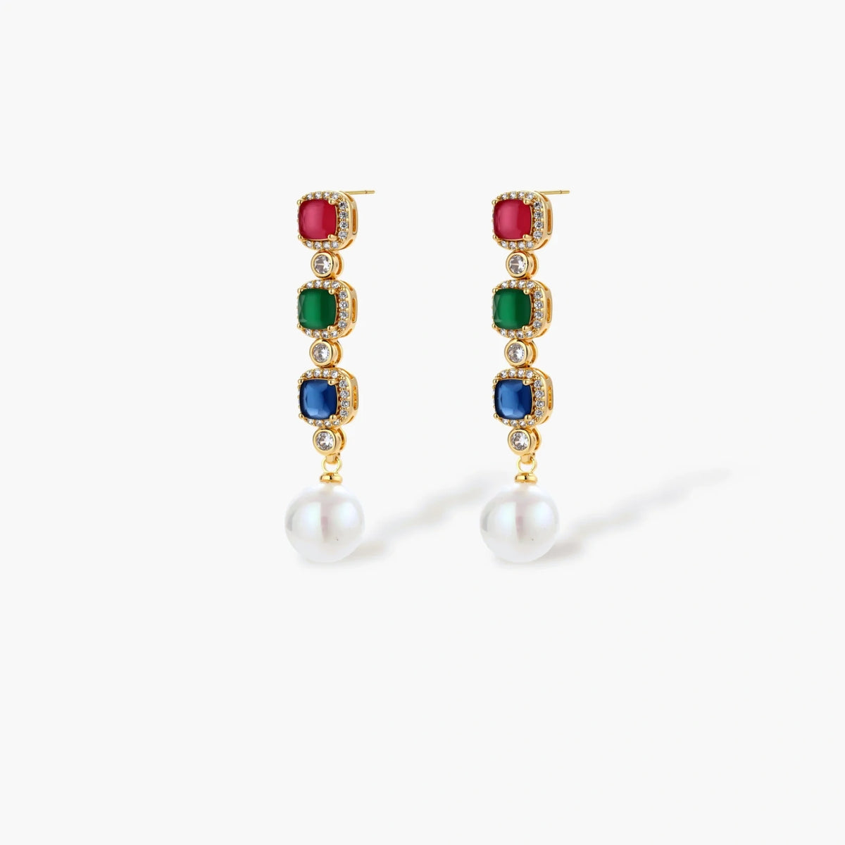 Gold-plated jewelry set with red, green, and blue cubic zirconia stones including necklace, bracelet, and drop earrings.