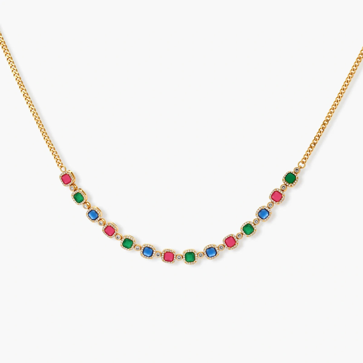 Gold-plated jewelry set with red, green, and blue cubic zirconia stones including necklace, bracelet, and drop earrings.
